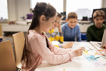 Image showing happy kids with invention kit at robotics school