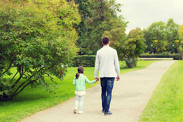 Image showing happy family walking in summer park