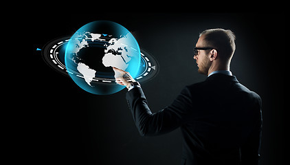 Image showing businessman with virtual earth projection