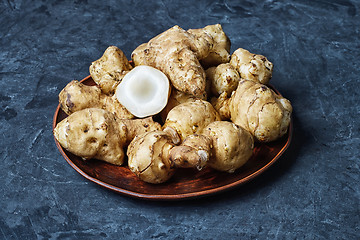 Image showing Jerusalem artichokes on dark background