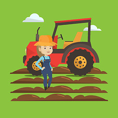 Image showing Farmer standing with tractor on background.