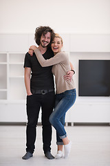 Image showing couple hugging in their new home