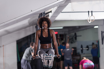 Image showing black woman doing parallel bars Exercise