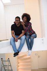 Image showing couple having break during moving to new house