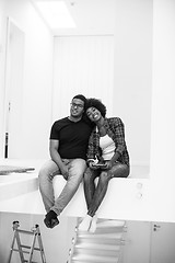 Image showing couple having break during moving to new house