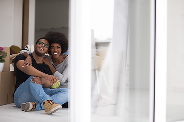 Image showing African American couple relaxing in new house