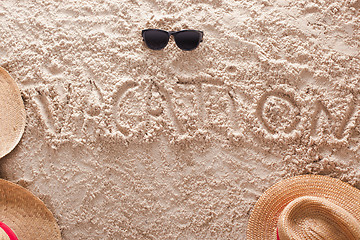 Image showing vacation written in a sandy tropical beach