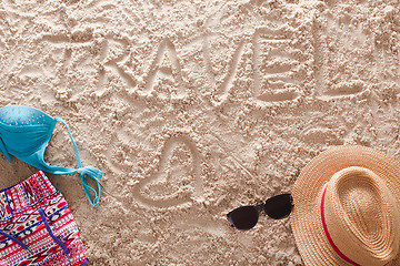 Image showing Travel written in a sandy tropical beach