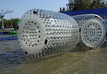 Image showing Zorbing. Runs inside a transparent sphere.