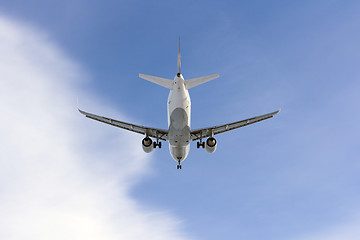 Image showing Airplane flies against a background of white cloud