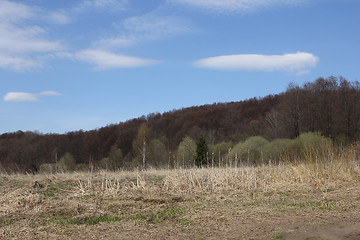 Image showing Mountains and field in the early spring on a blue sky background