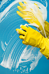 Image showing Man washes in rubber gloves
