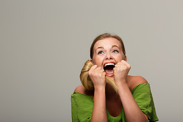 Image showing Cheerful woman in green dress