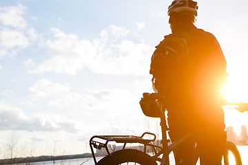 Image showing Girl in helmet with bicycle