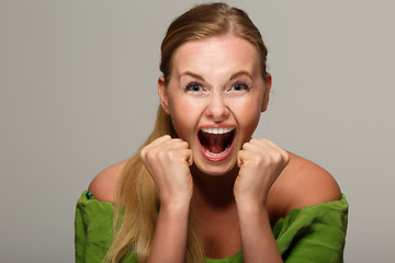 Image showing Screaming girl in green dress