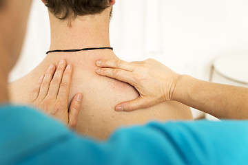 Image showing young man at the physio therapy with pain