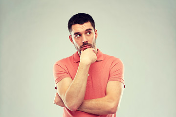 Image showing man thinking over gray background