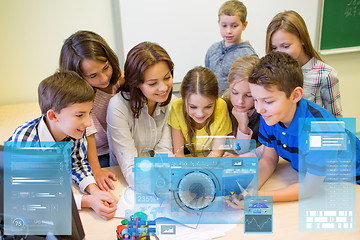 Image showing group of kids with teacher and tablet pc at school