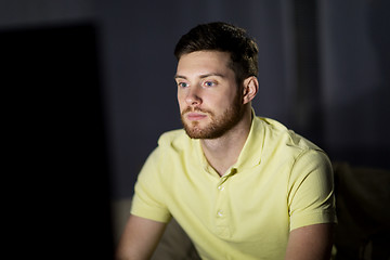 Image showing young man watching tv at night