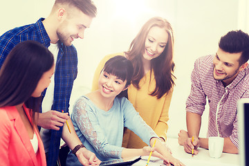 Image showing happy creative team or students working at office