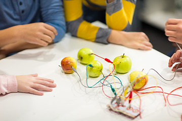 Image showing kids hands with invention kit at robotics school