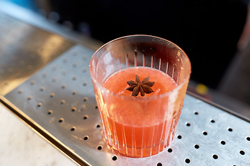 Image showing glass of cocktail with anise at bar