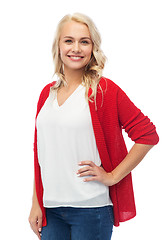 Image showing happy smiling young woman in red cardigan