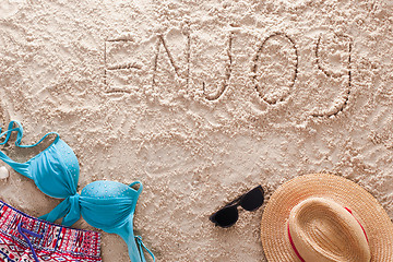 Image showing Enjoy written in a sandy tropical beach