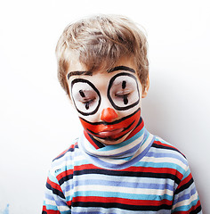 Image showing little cute boy with facepaint like clown, pantomimic expression