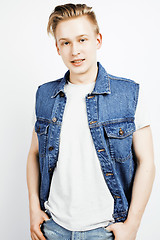 Image showing young handsome teenage hipster guy posing emotional, happy smiling against white background isolated, lifestyle people concept closeup