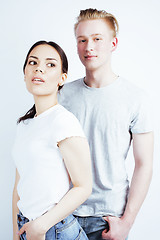 Image showing best friends teenage asian girl and boy together having fun, posing emotional on white background, couple happy smiling, lifestyle people concept, blond and brunette multi nations 