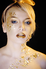 Image showing beauty blond woman with gold creative make up