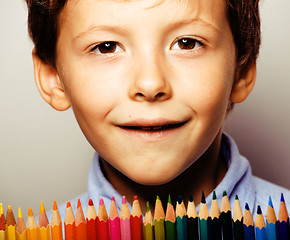 Image showing little cute boy with color pencils close up smiling, education f