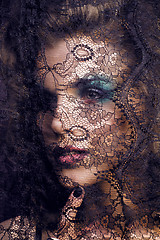 Image showing portrait of beauty young woman through lace close up mistery mak