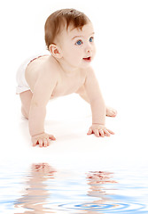 Image showing crawling baby boy looking up