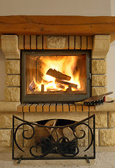 Image showing Roaring flames in modern fireplace