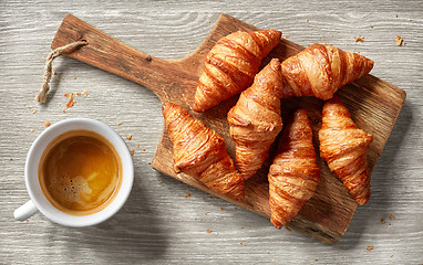 Image showing freshly baked croissants and coffee cup