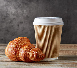 Image showing paper coffee cup and croissant