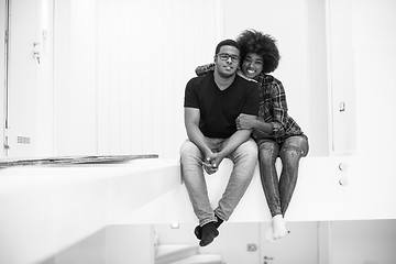 Image showing couple having break during moving to new house