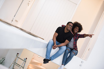 Image showing couple having break during moving to new house