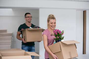 Image showing young couple moving into a new home