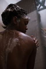 Image showing African American woman in the shower