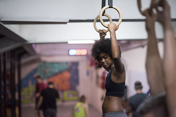 Image showing black woman doing dipping exercise