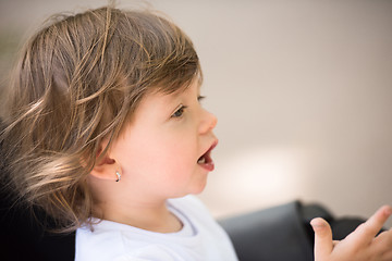 Image showing baby girl sitting in the pram