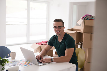 Image showing Young man moving in a new home