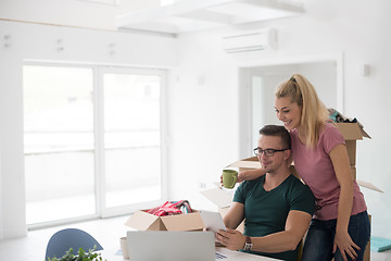 Image showing Young couple moving in a new home