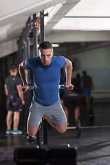 Image showing man doing exercises parallel bars