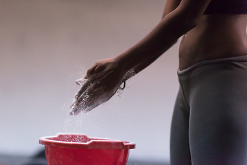 Image showing black woman preparing for climbing workout