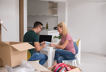 Image showing Young couple moving in a new home