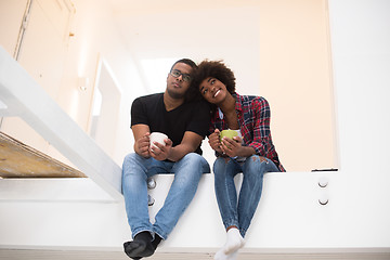 Image showing couple having break during moving to new house